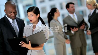 Young Business Executives with Work Portfolios