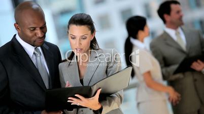 Multi Ethnic Business Team Meeting in Modern Building