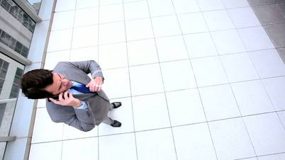 Male Business Executive Using Smartphone