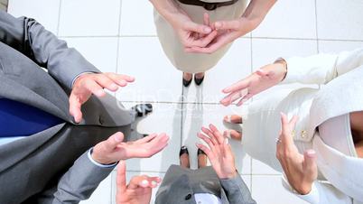 Hands of City Business People Showing Unity