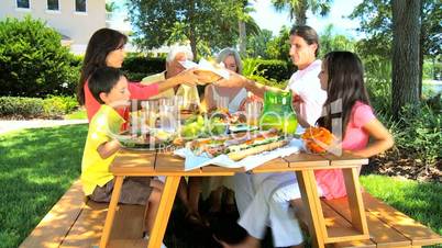 Caucasian Family Generations Eating Outdoors