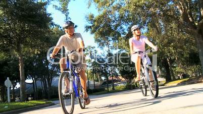 Fit & Healthy Retired Couple Cycling Together