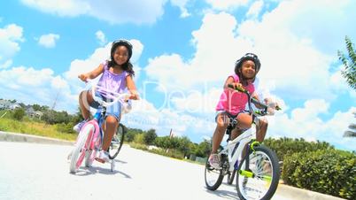 Healthy Ethnic Family Bike Riding Together