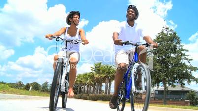 Attractive African American Couple Cycling Together