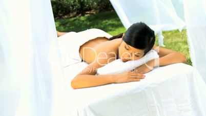 Asian Girl Relaxing After Massage Treatment