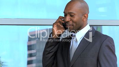 Ethnic Businessman in Close up Talking on Smartphone