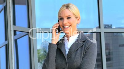 Young Female Business Executive Talking on Smartphone