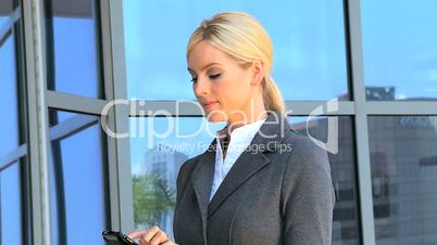 Female Business Executive with Smartphone in Close up