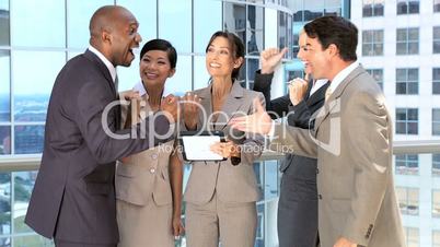 Ambitious Business Team Congratulating Each Other