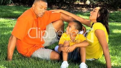 Loving Young Ethnic Family Unit Together Outdoors