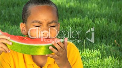 Young Ethnic Boy Eating Refreshing Water Melon