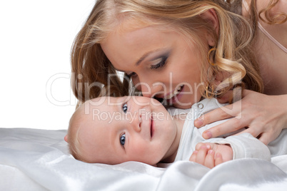 Beauty blond woman kiss a baby