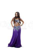 beauty dancer posing in oriental purple costume