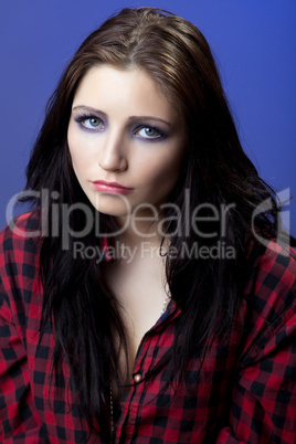 Young depressed girl in red shirt look with sad