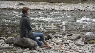 young woman meditating on the nature