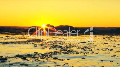 Sun Setting Over an Arctic Glacier