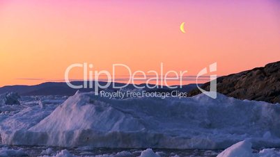 Arctic Sunset & Moon Shining on Melting Ice