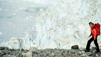 Lone Female on Hiking Expedition by a Glacier