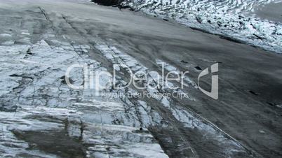 Aerial view of an Ice glacier dusted with black Volcanic ash, Iceland
