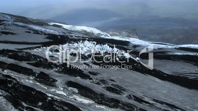 Aerial view of ice formations covered in volcanic ash, Iceland