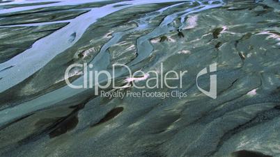 Aerial view of melting snow and ice forming river deltas, Iceland