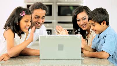 Asian Family Using Laptop for Online Video Chat