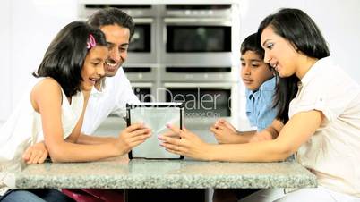 Asian Family Using Wireless Tablet  for Online Webchat