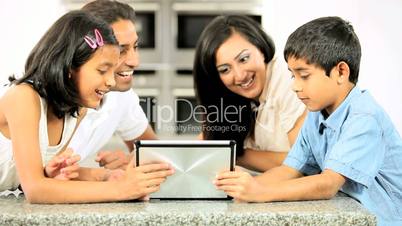Asian Family Playing on Wireless Tablet