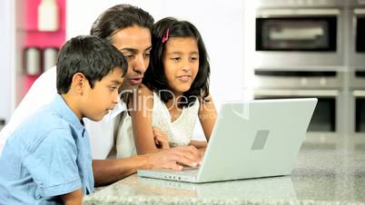 Asian Father & Children Using Laptop