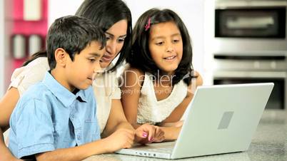 Young Asian Mother & Children Using Laptop