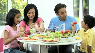 Young Ethnic Family Enjoying a Healthy Meal