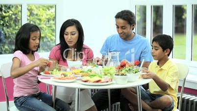 Young Asian Family Sharing Healthy Lunch Together