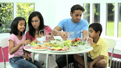 Attractive Asian Family Eating Together