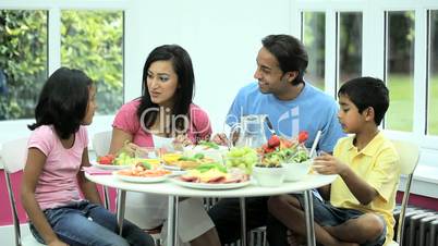 Young Asian Family Eating Healthy Lunch Together