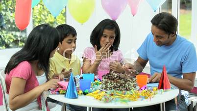 Asian Family Enjoying Delicious Birthday Cake