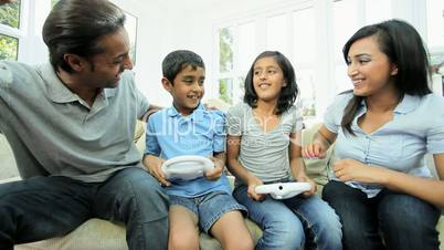 Asian Children Enjoying Home Games Console