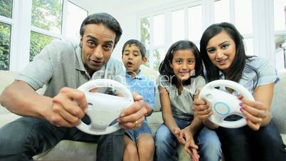 Ethnic Parents Having Fun on Games Console