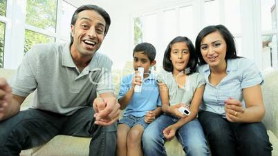 Young Ethnic Children Playing on Home Games Console