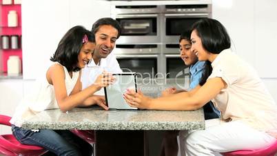 Asian Family Using Wireless Tablet  for Online Video Chat