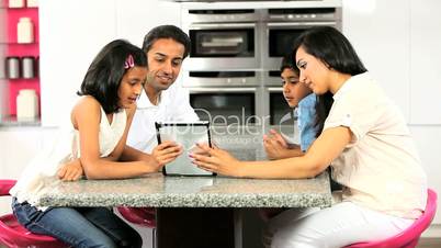 Asian Family Using Wireless Tablet  for Online Webchat