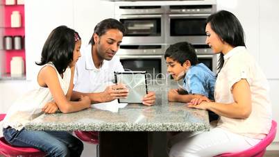 Young Asian Family Using Wireless Tablet
