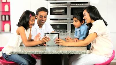 Young Ethnic Family Using Laptop for Webchat