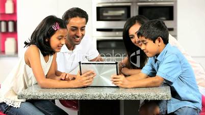 Young Asian Family Having Fun with  Wireless Tablet