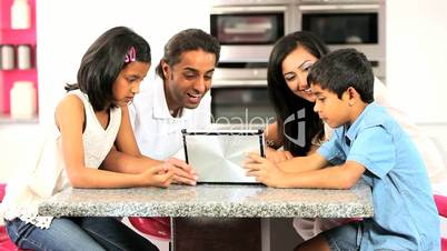 Asian Family Playing on Wireless Tablet