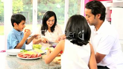 Asian Family Preparing Healthy Meal Together