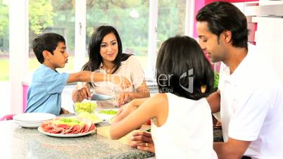 Young Asian Family Making Healthy Lunch