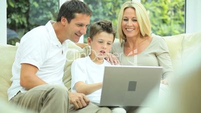 Young Family Using Laptop for Webchat