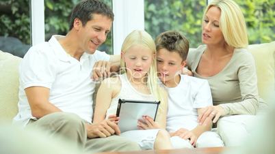 Caucasian Family Playing on Wireless Tablet