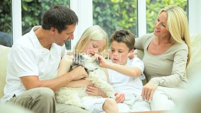 Young Caucasian Family with Pet Dog