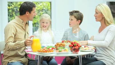 Young Caucasian Family Eating Healthy Lunch Together
